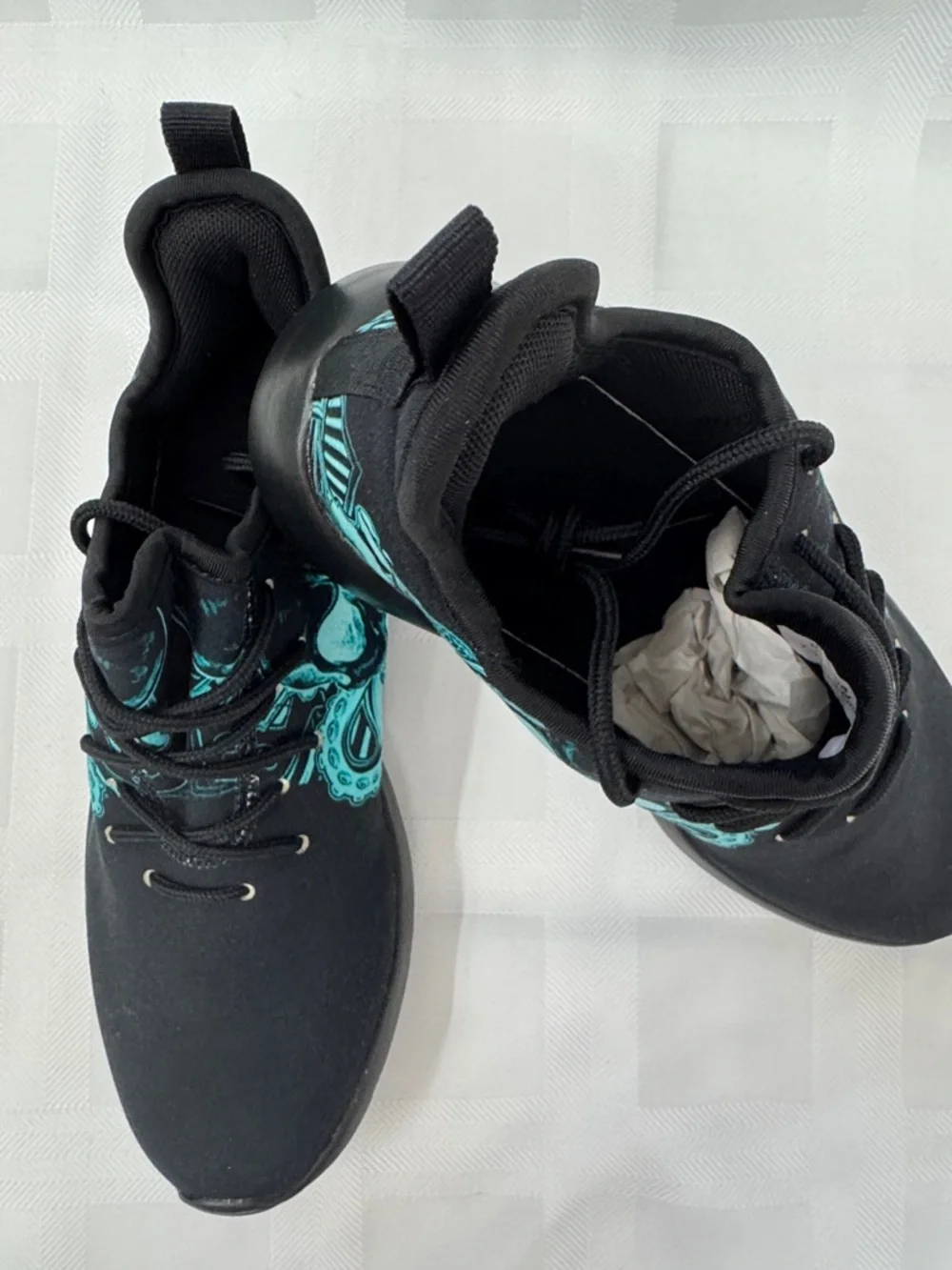 Unisex Black Lightweight Sneakers with Teal Skull Accent